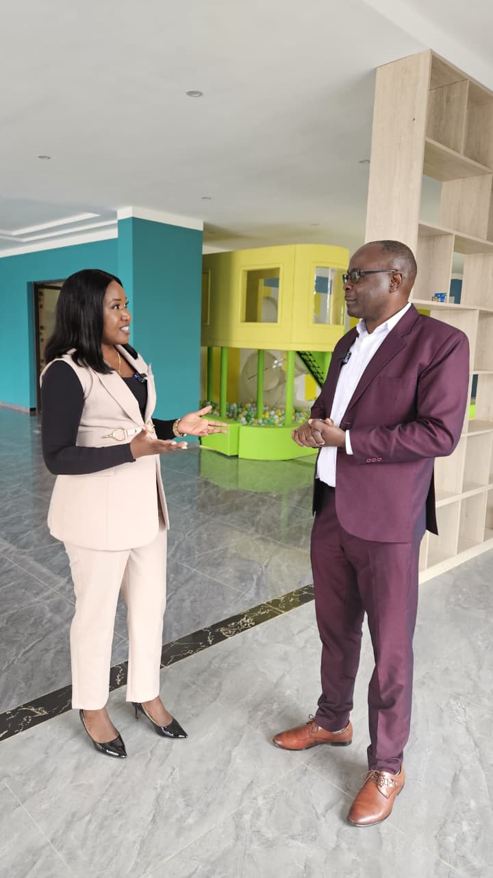 Brenda Kiogora consulting with a client during a property tour